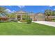 Beautiful single story home with manicured lawn, mature palms, and two car garage at 4832 Carrington Cir, Sarasota, FL 34243