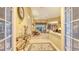 Bright foyer with tiled floors, glass table, and views of the elegant living spaces at 4832 Carrington Cir, Sarasota, FL 34243