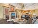 Open-concept living room with modern built-ins, view to kitchen, and ample seating at 4832 Carrington Cir, Sarasota, FL 34243