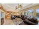 Living room featuring comfortable furniture, an open floor plan, and views to a pool at 4832 Carrington Cir, Sarasota, FL 34243