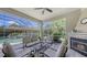Screened-in patio area with a fireplace and comfortable seating at 4832 Carrington Cir, Sarasota, FL 34243