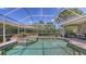 Beautiful pool with spa and screened enclosure, surrounded by lush landscaping and patio area at 4832 Carrington Cir, Sarasota, FL 34243