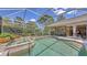 Inviting pool and spa with a screened enclosure, patio, and outdoor living space at 4832 Carrington Cir, Sarasota, FL 34243
