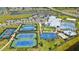 Aerial view of the community center with a pool, tennis courts, and basketball court at 4951 Oyster Pearl St, Lakewood Ranch, FL 34211