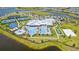 Aerial view of community center with pools, tennis, basketball, and bocce ball courts at 4951 Oyster Pearl St, Lakewood Ranch, FL 34211