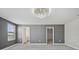 Large bedroom featuring plush carpet, view to bathroom and walk-in closet at 4951 Oyster Pearl St, Lakewood Ranch, FL 34211
