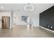 Open floor plan with sleek hardwood floors and a stunning chandelier at 4951 Oyster Pearl St, Lakewood Ranch, FL 34211