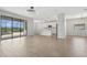 Bright living space featuring wood floors, modern lighting, and sliding doors to the screened lanai at 4951 Oyster Pearl St, Lakewood Ranch, FL 34211