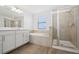 Well-lit bathroom with separate shower, tub, and double vanity at 4951 Oyster Pearl St, Lakewood Ranch, FL 34211