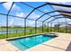 Enclosed pool and hot tub area with gorgeous lake views at 4951 Oyster Pearl St, Lakewood Ranch, FL 34211