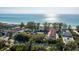 Stunning aerial view of a beautiful beachfront community with manicured landscaping and ocean views at 5055 Gulf Of Mexico Dr # 414, Longboat Key, FL 34228