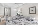 Cozy bedroom featuring two twin beds, nautical-themed decor, and closet with nearby bathroom at 5055 Gulf Of Mexico Dr # 414, Longboat Key, FL 34228