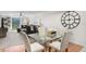 A combined dining and living space with large glass doors that open to the home's exterior at 5055 Gulf Of Mexico Dr # 414, Longboat Key, FL 34228