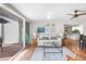 Comfortable living room with sliding glass doors and adjacent kitchen at 5055 Gulf Of Mexico Dr # 414, Longboat Key, FL 34228