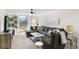 Cozy living room with comfortable seating and access to outdoor patio at 5055 Gulf Of Mexico Dr # 414, Longboat Key, FL 34228