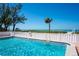 Sparkling pool with a view of the beach and ocean at 5055 Gulf Of Mexico Dr # 414, Longboat Key, FL 34228