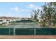 Well-maintained tennis courts surrounded by lush landscaping at 5055 Gulf Of Mexico Dr # 414, Longboat Key, FL 34228