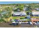 Aerial view of property featuring a boat dock, waterfront, and landscaping at 5206 18Th E Ave, Bradenton, FL 34208