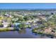 Scenic aerial view of waterfront homes with docks and lush green landscaping in a charming neighborhood at 5206 18Th E Ave, Bradenton, FL 34208