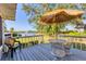 Charming deck area with outdoor seating and serene waterfront views at 5206 18Th E Ave, Bradenton, FL 34208