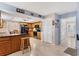 The kitchen is adjacent to the dining area and features oak cabinets and stainless steel appliances at 5206 18Th E Ave, Bradenton, FL 34208
