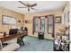 Comfortable office space with a ceiling fan, a wooden desk, and plenty of natural light at 5206 18Th E Ave, Bradenton, FL 34208