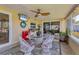 Waterfront patio featuring a seating area, outdoor bar, and beautiful waterfront views at 5206 18Th E Ave, Bradenton, FL 34208