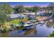Waterfront home featuring a private boat dock and lift, perfect for enjoying the coastal lifestyle at 5206 18Th E Ave, Bradenton, FL 34208