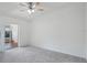 Bright bedroom features neutral carpet, ceiling fan, and sliding glass doors at 5382 Royal Palm Ave # 5382, Sarasota, FL 34234
