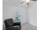 Cozy bedroom showcasing a comfortable reading chair and natural light at 5382 Royal Palm Ave # 5382, Sarasota, FL 34234