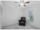 Cozy bedroom showcasing a comfortable reading chair and natural light at 5382 Royal Palm Ave # 5382, Sarasota, FL 34234