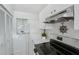 Well-lit kitchen featuring stainless steel appliances, white cabinets, and a functional layout for easy meal preparation at 5382 Royal Palm Ave # 5382, Sarasota, FL 34234