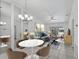 Bright living room featuring stylish furniture and modern lighting at 5382 Royal Palm Ave # 5382, Sarasota, FL 34234