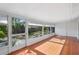Enclosed sunroom with tiled flooring and a backyard view at 5382 Royal Palm Ave # 5382, Sarasota, FL 34234