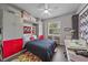 Functional bedroom featuring a murphy bed, built-in storage, and dedicated workspace for versatility at 5554 Eastwind Dr, Sarasota, FL 34233