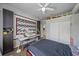 Comfortable bedroom with ceiling fan, closet, and a desk area, perfect for relaxing or working at 5554 Eastwind Dr, Sarasota, FL 34233