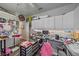 Bright craft room with ample storage and workspace, perfect for creative projects and organization at 5554 Eastwind Dr, Sarasota, FL 34233