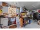 Organized garage featuring a workbench, storage cabinets, and tool racks, ideal for projects and maintenance at 5554 Eastwind Dr, Sarasota, FL 34233