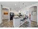 Open kitchen with granite counters, stainless appliances, tile floors, and bar seating at 5554 Eastwind Dr, Sarasota, FL 34233
