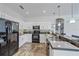 Bright kitchen with granite counters, stainless appliances, and tile flooring at 5554 Eastwind Dr, Sarasota, FL 34233