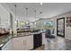 View of an open kitchen with granite counters and stainless appliances, and adjoining dining area at 5554 Eastwind Dr, Sarasota, FL 34233