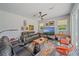 Cozy living room with theater seating, TV, and natural lighting at 5554 Eastwind Dr, Sarasota, FL 34233