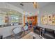 Modern living room featuring stylish seating, a built-in bar, and unique art at 5554 Eastwind Dr, Sarasota, FL 34233