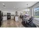 Open concept living space with a modern kitchen, dining area, and comfortable living room at 5554 Eastwind Dr, Sarasota, FL 34233