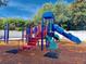 Vibrant community playground with multiple slides and activities for recreation and enjoyment at 5554 Eastwind Dr, Sarasota, FL 34233