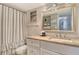 Bathroom featuring marble countertop vanity with vanity and shower/tub combination at 5920 Midnight Pass Rd # 406, Sarasota, FL 34242