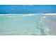 Scenic beach scene featuring bright turquoise waters meeting a pristine white shoreline at 5920 Midnight Pass Rd # 406, Sarasota, FL 34242