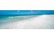 Expansive, beautiful white sand beach with pristine turquoise waters and gentle waves at 5920 Midnight Pass Rd # 406, Sarasota, FL 34242