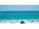 Stunning beach view featuring the turquoise ocean, clear blue sky and the white sands at 5920 Midnight Pass Rd # 406, Sarasota, FL 34242