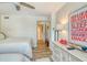 Cozy bedroom featuring two beds, light walls, and artistic decor at 5920 Midnight Pass Rd # 406, Sarasota, FL 34242